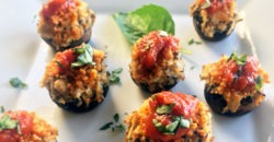 Chicken Parmesan Stuffed Mushrooms with tomato sauce and fresh basil.