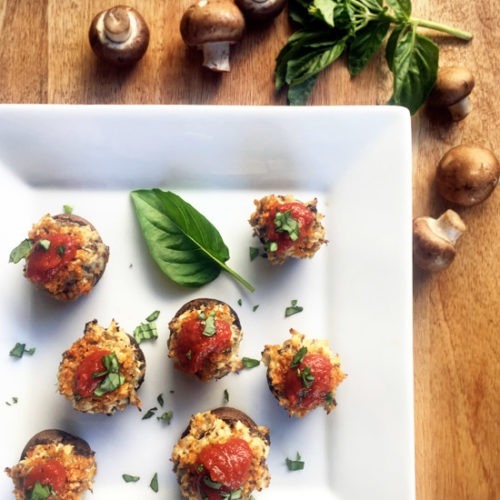 Chicken Parmesan Stuffed Mushrooms with tomato sauce and basil