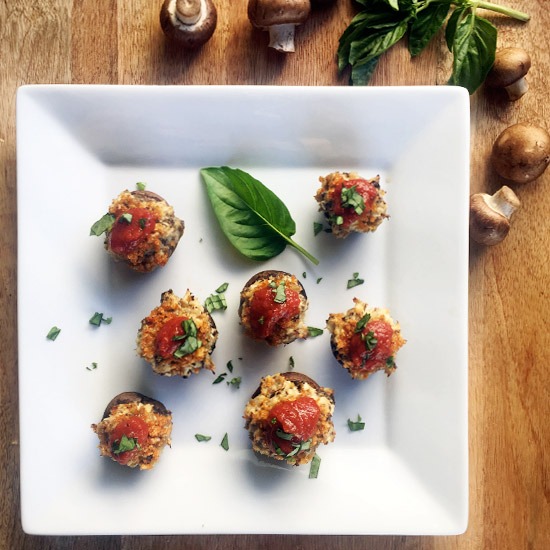 Chicken Parmesan Stuffed Mushrooms with tomato sauce and basil