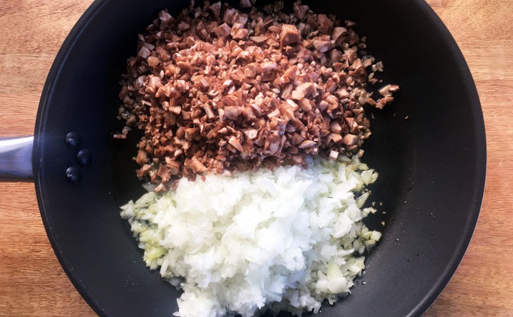 Saute finely diced onions and mushroom stems in olive oil.