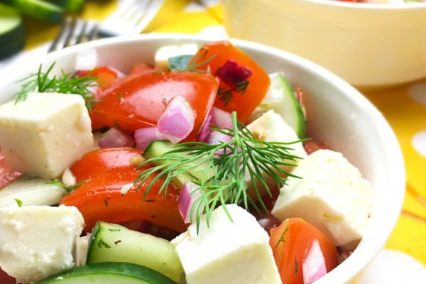 Tangy Tomato Cucumber Salad with Dill is so easy yet so flavorful, and it is perfect for summer. Fresh cucumbers and tomatoes get all marinated up in a dilled rice vinegar dressing. Red onions and feta cheese add some extra zing to this delicious summer salad!